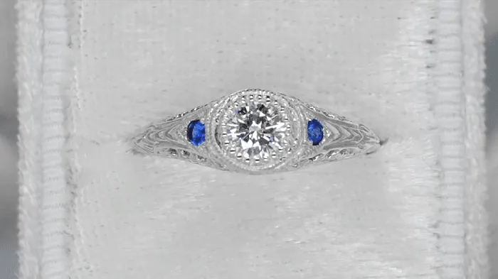 Antique Jewelry Mall Platinum Art Deco Vintage Engraved Filigree Diamond Engagement Ring with Side Blue Sapphires Rings Antique Jewelry Mall Platinum Art Deco Vintage Engraved Filigree Diamond Engagement Ring with Side Blue Sapphires Rings