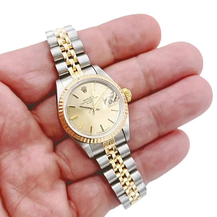 Rolex Rings Ladies Rolex 26mm Date 18K Yellow Gold Two Tone Watch with Champagne Dial and Fluted Bezel PreOwned 69173