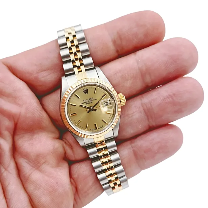 Rolex Rings Ladies Rolex 26mm Date 18K Yellow Gold Two Tone Watch with Champagne Dial and Fluted Bezel PreOwned 69173